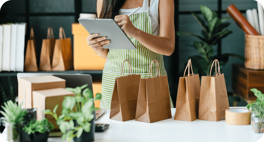 Merchant preparing online orders at retail workspace
