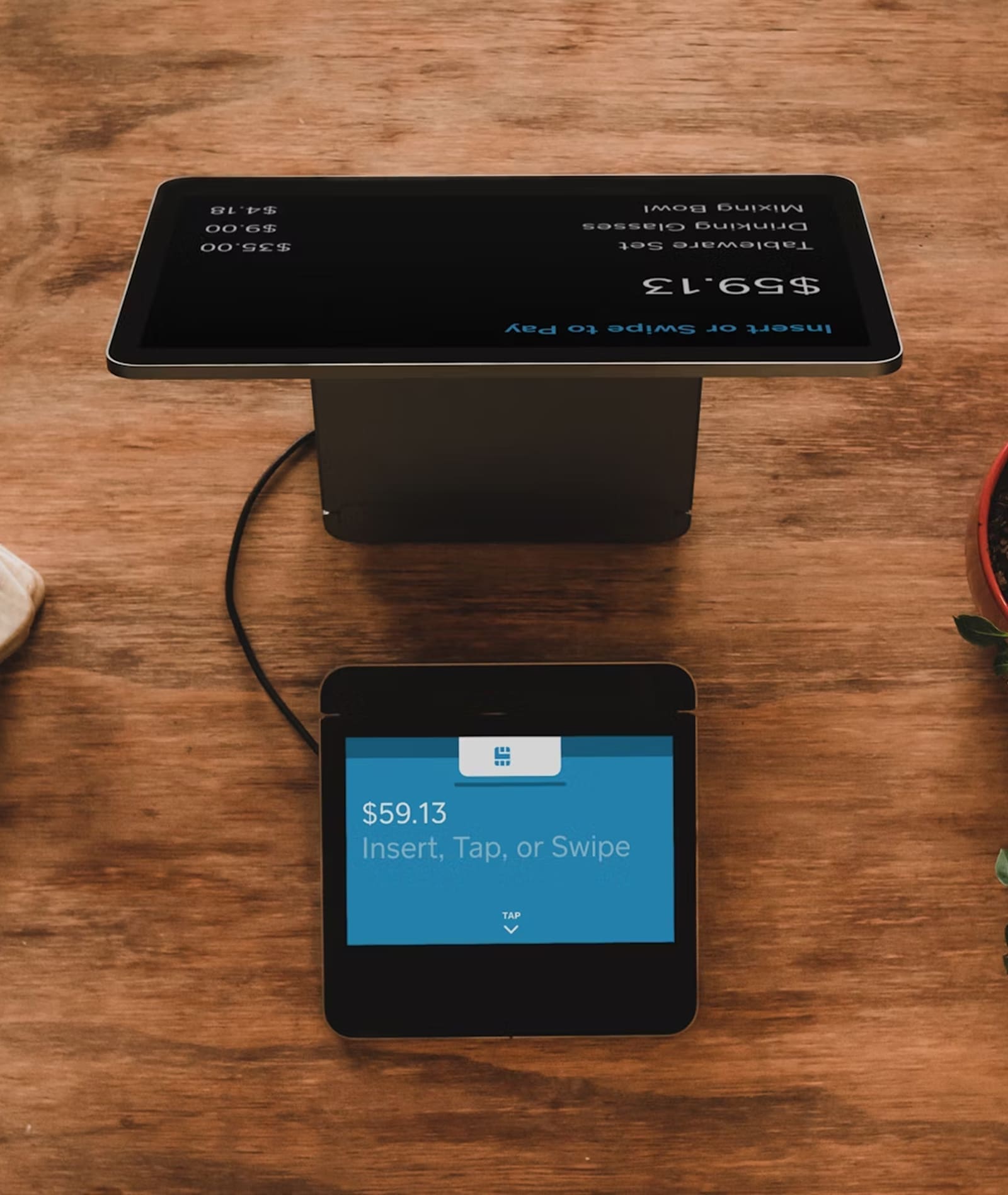 POS terminal and card reader processing payment