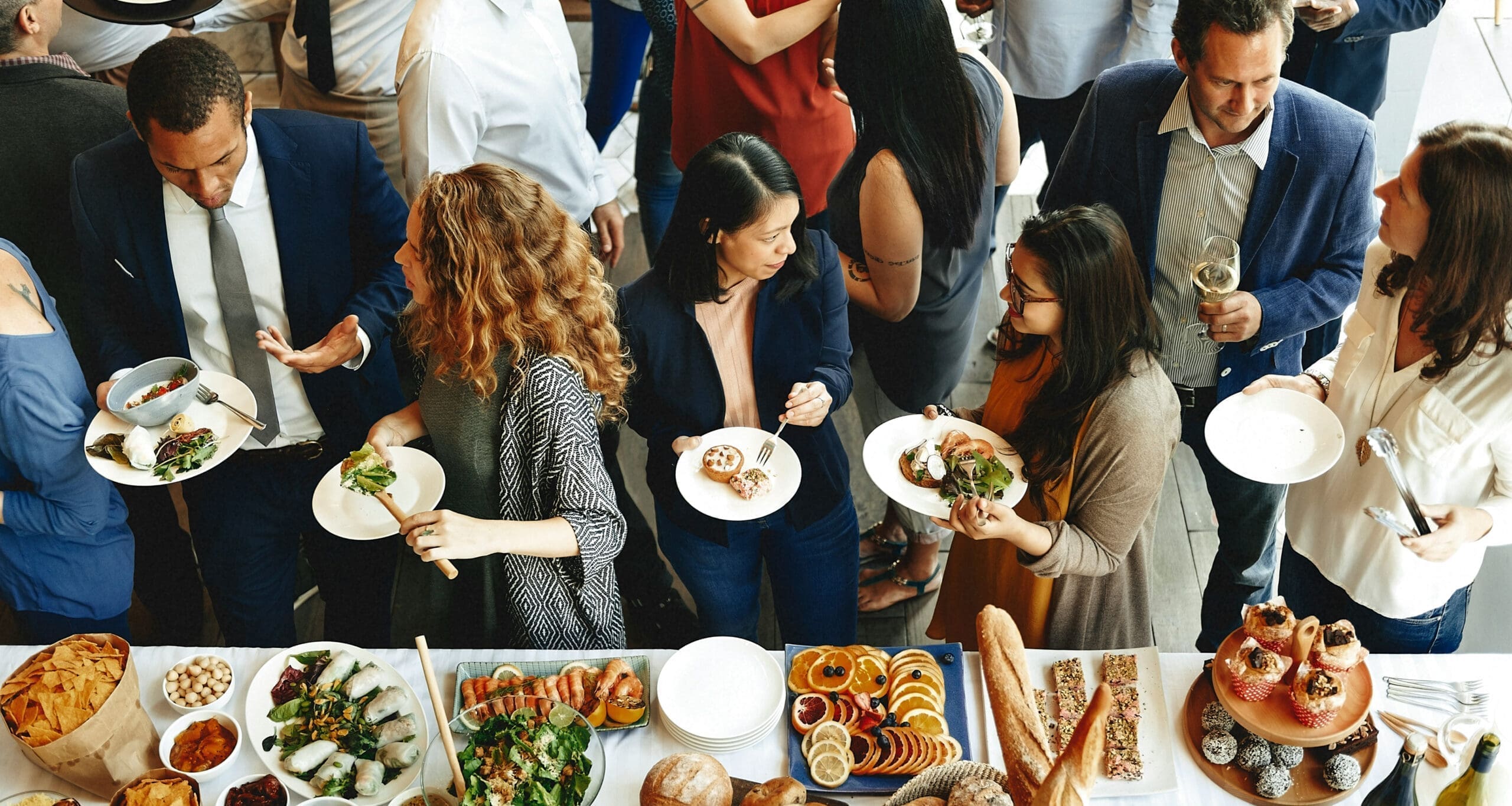 Guests selecting food at catered buffet