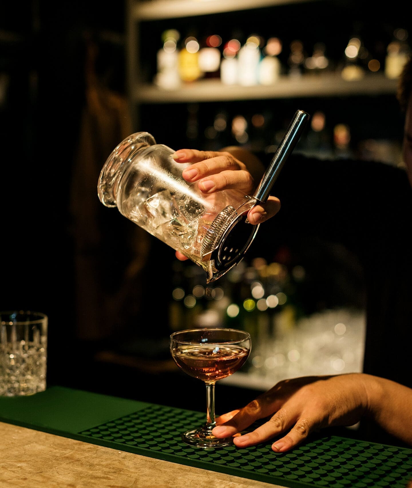 Bartender pouring cocktail