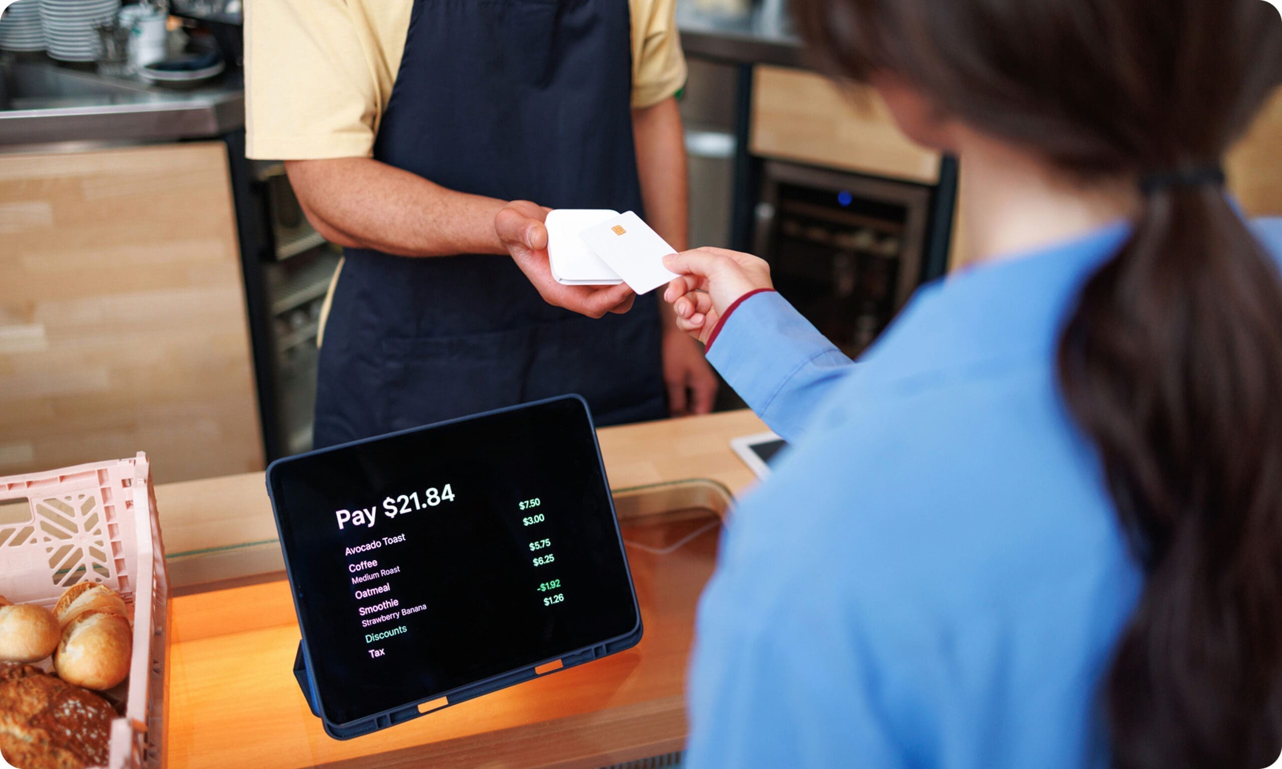 Customer paying at checkout using POS system