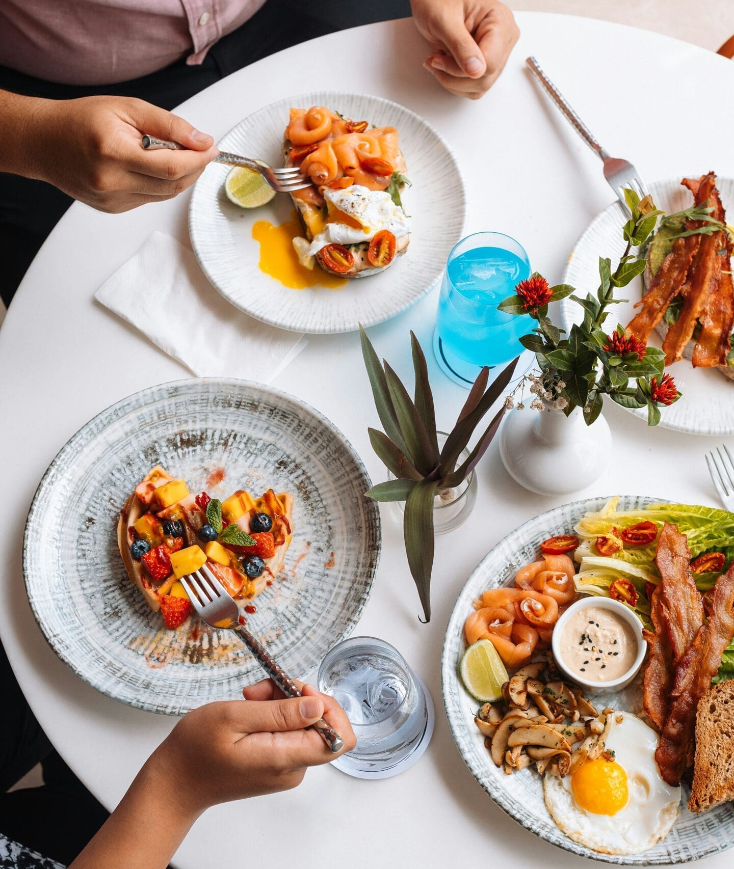Customers dining at restaurant table