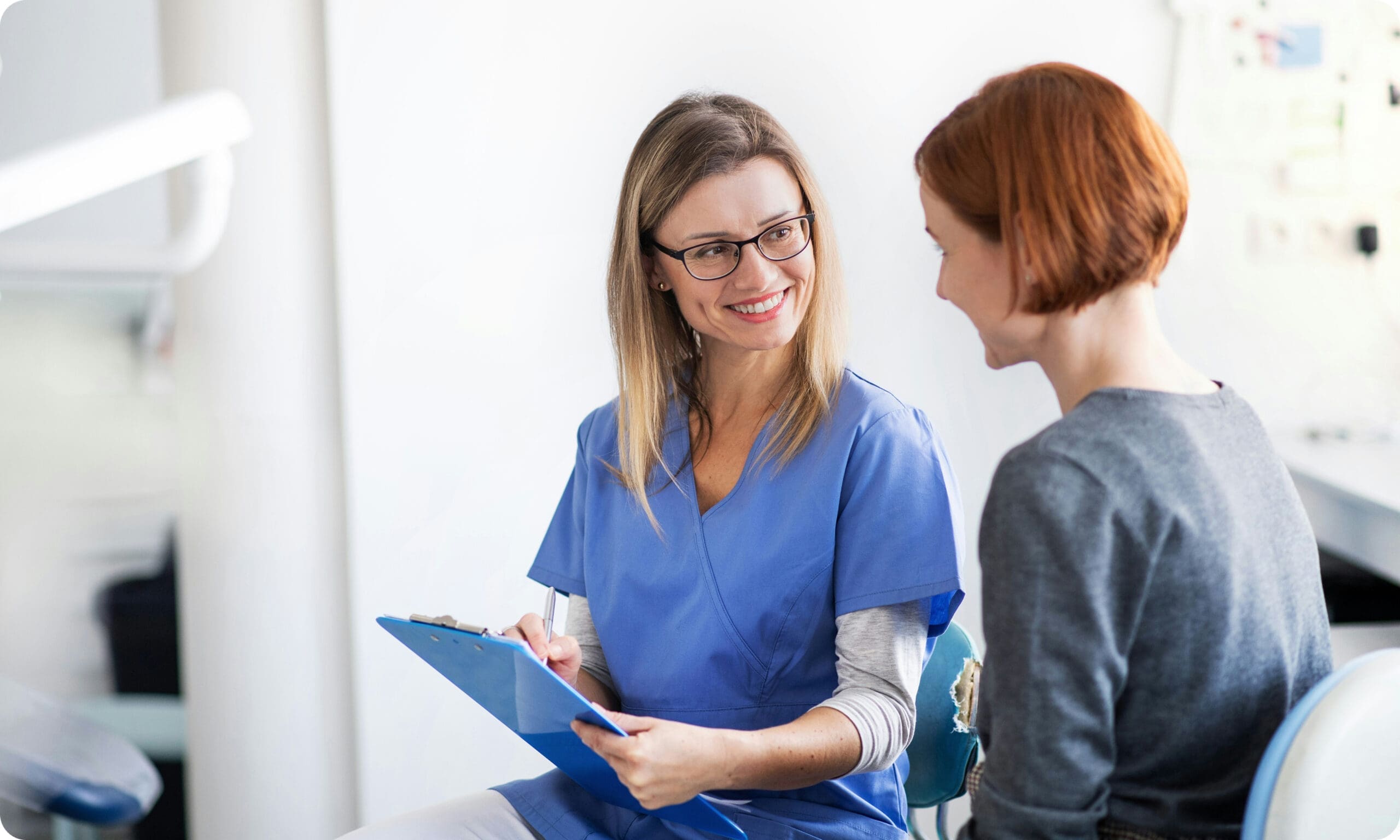 Dentist discussing treatment plan with patient