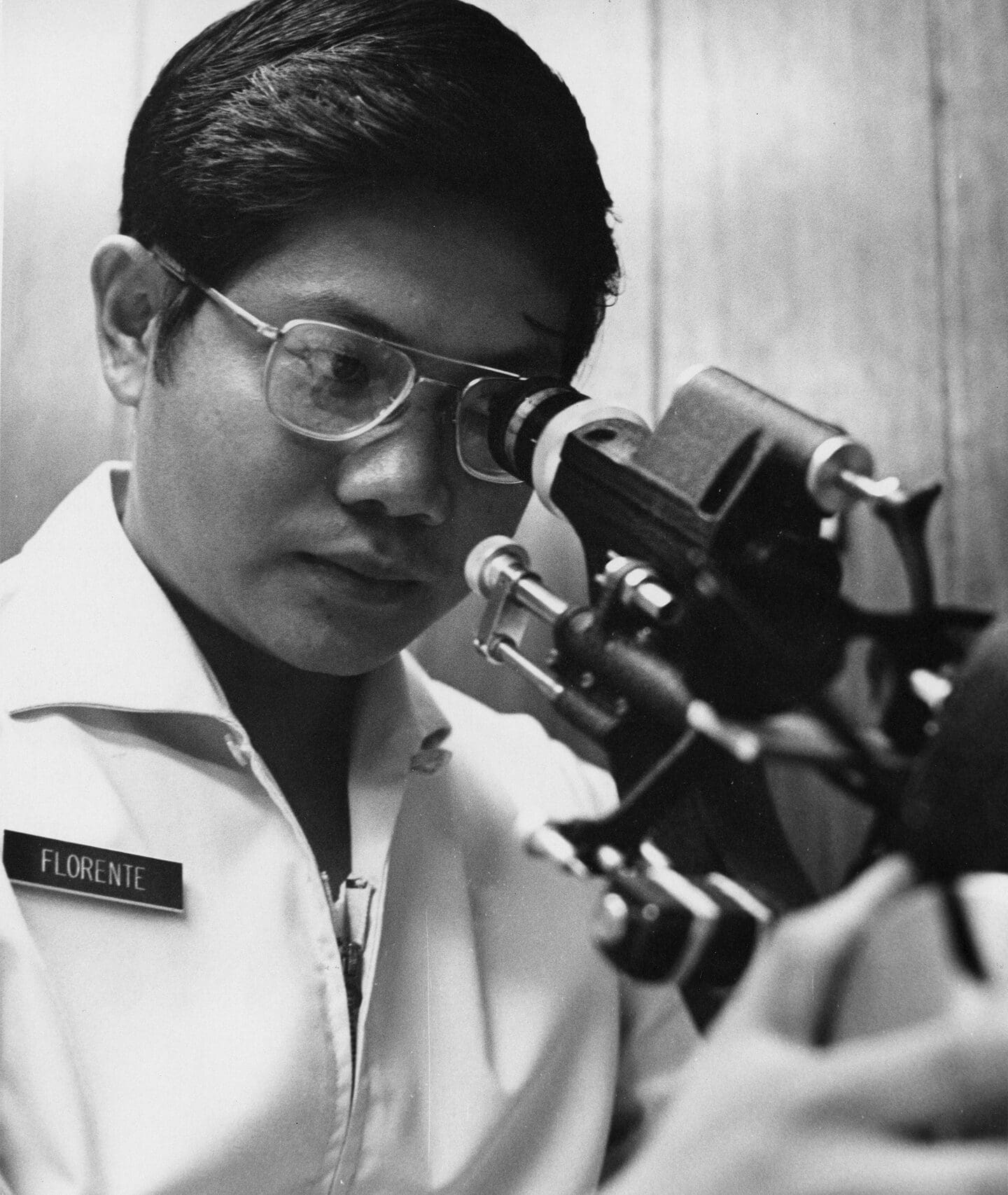 Scientist using microscope in laboratory