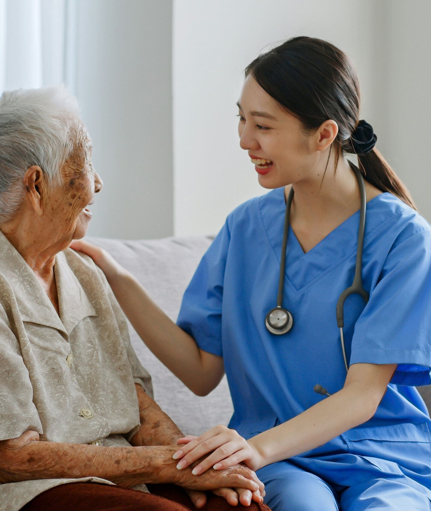 Nurse assisting elderly patient