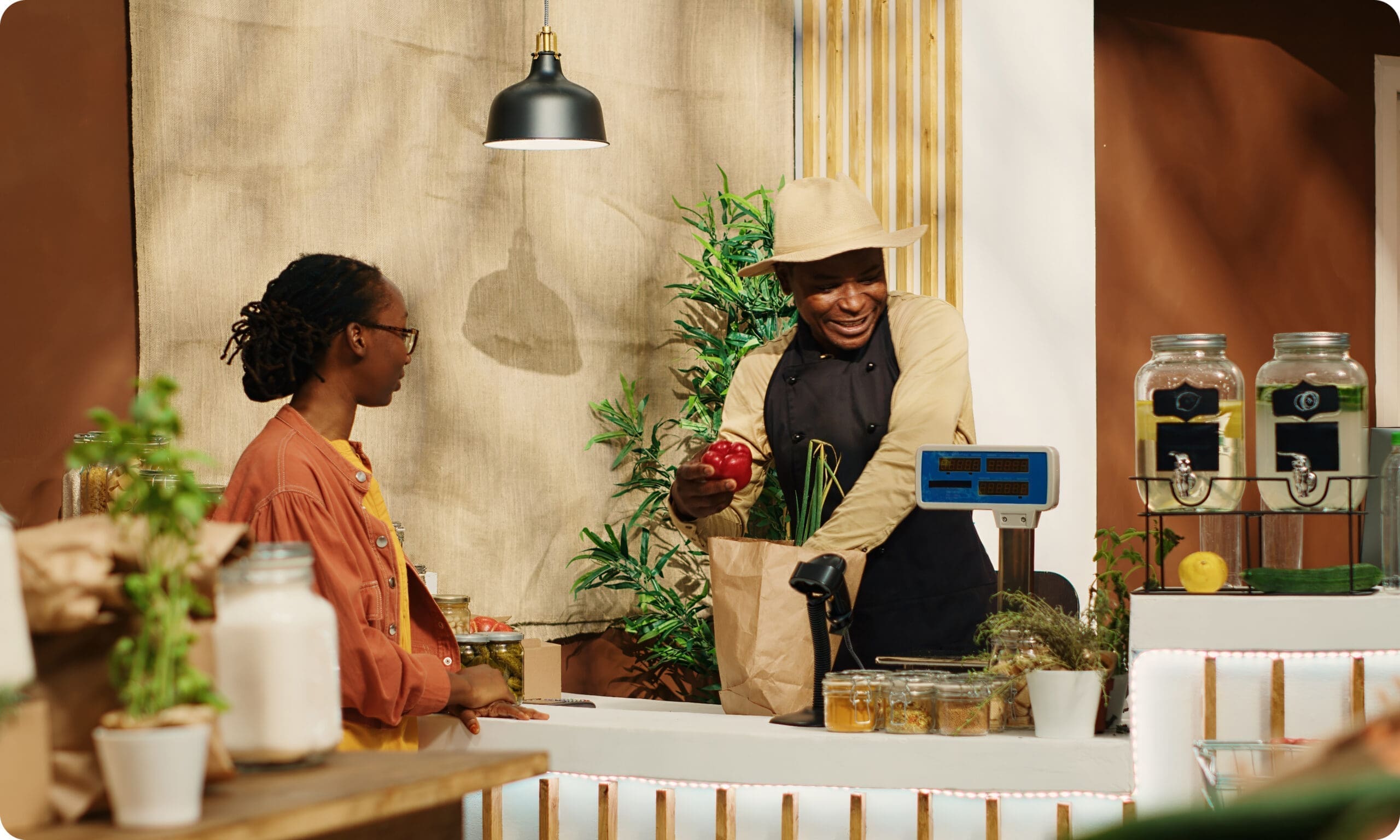 Small business owner serving customer at retail counter