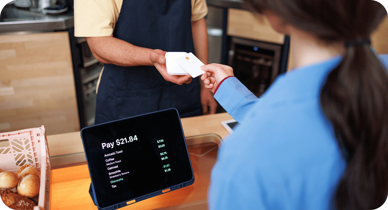 Customer paying at checkout using POS system