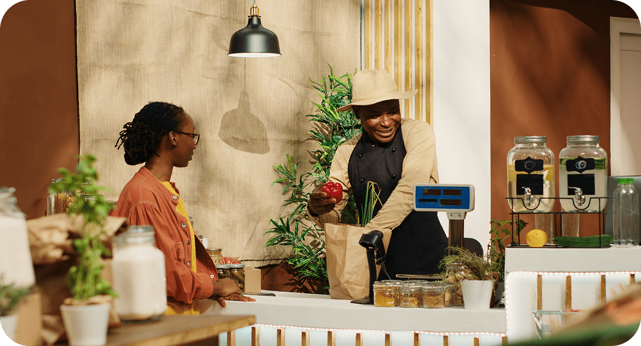 Retail merchant assisting customer at checkout