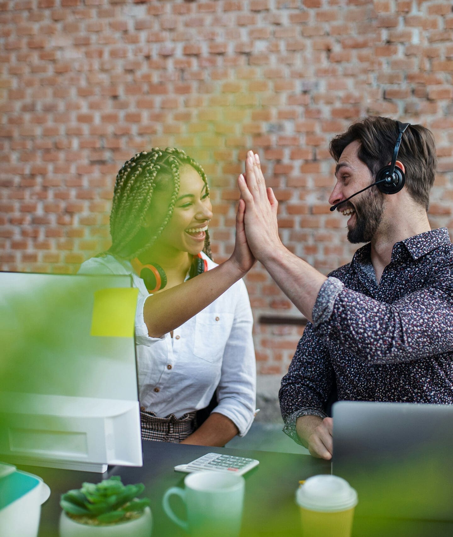 Coworkers doing a high-five