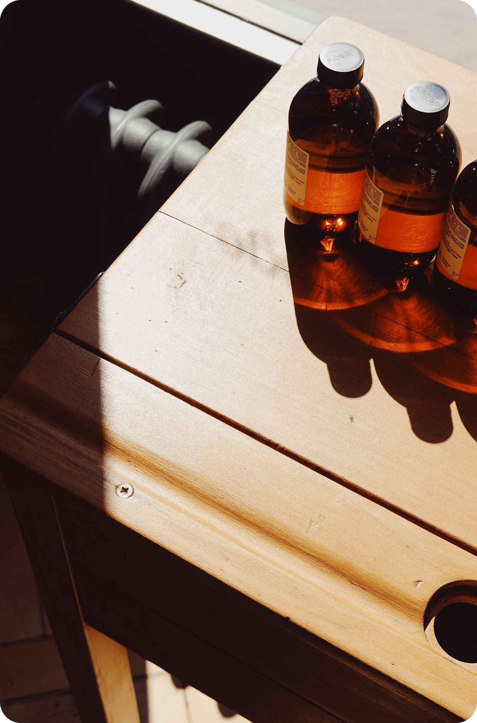 Glass bottles on wooden table