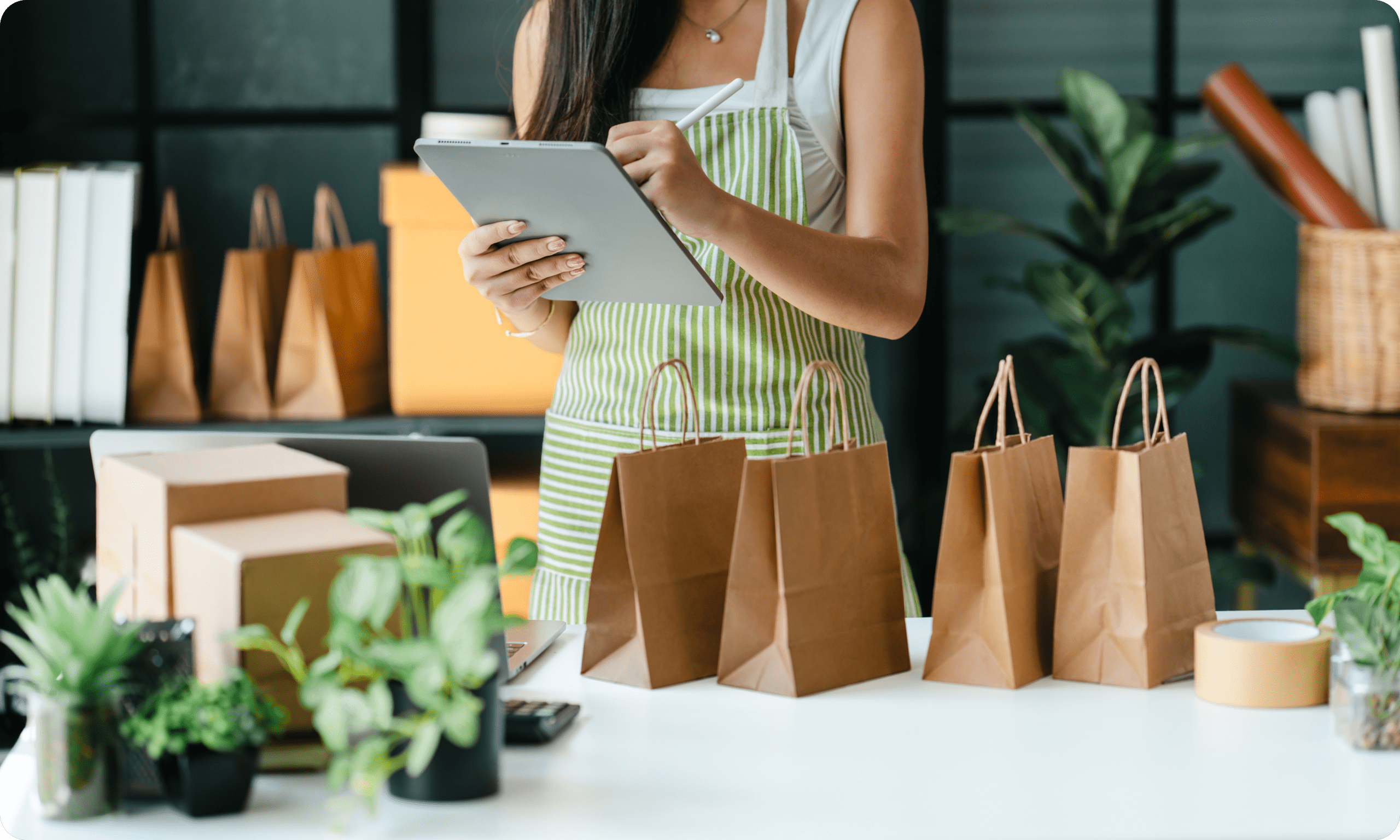 Small business owner preparing customer orders using a tablet