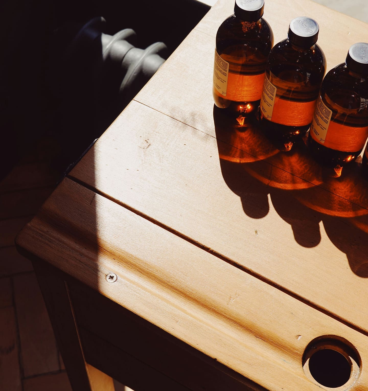 Glass bottles on wooden table