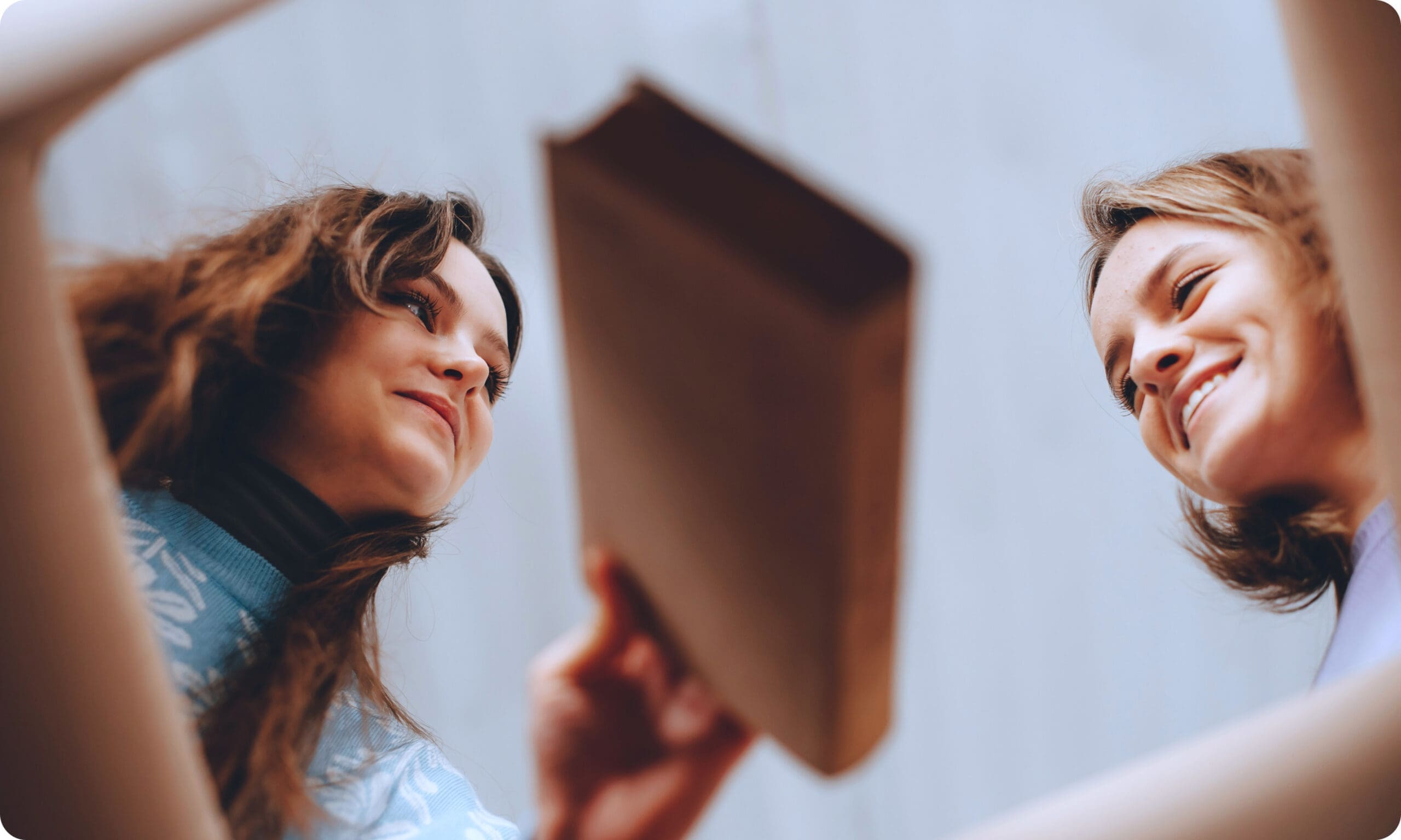 Two people packing a shopping bag